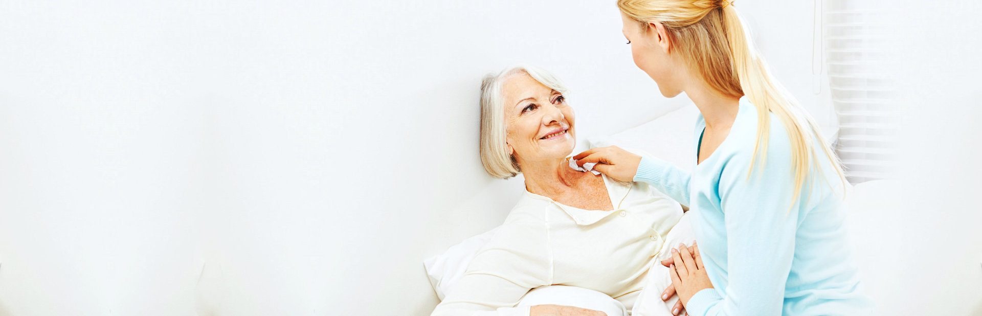 caregiver taking care of the elder woman