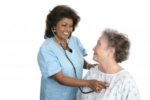 A nurse checking a patients vital signs