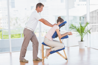 therapist pushing the back of the woman