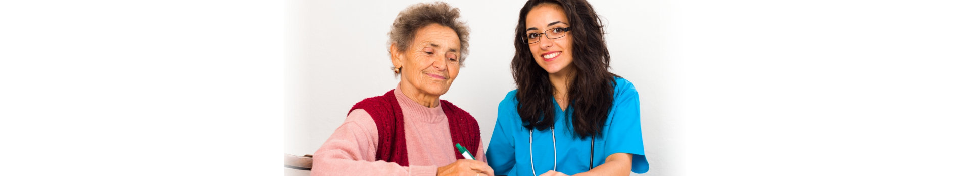 Nurse Helping Elderly Register for Nursing Home